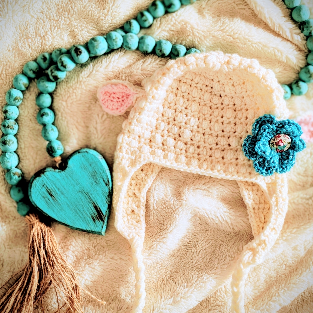 Handmade Cream Crochet Baby Hat with Blue Flower